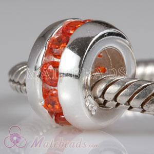 Sterling silver bead with orange stones