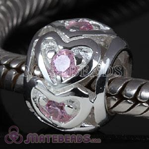 Sterling silver heart beads with pink stones